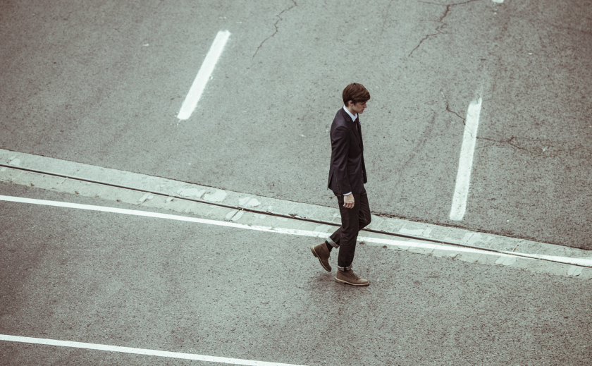 International student parent worries lonely man crossing the road