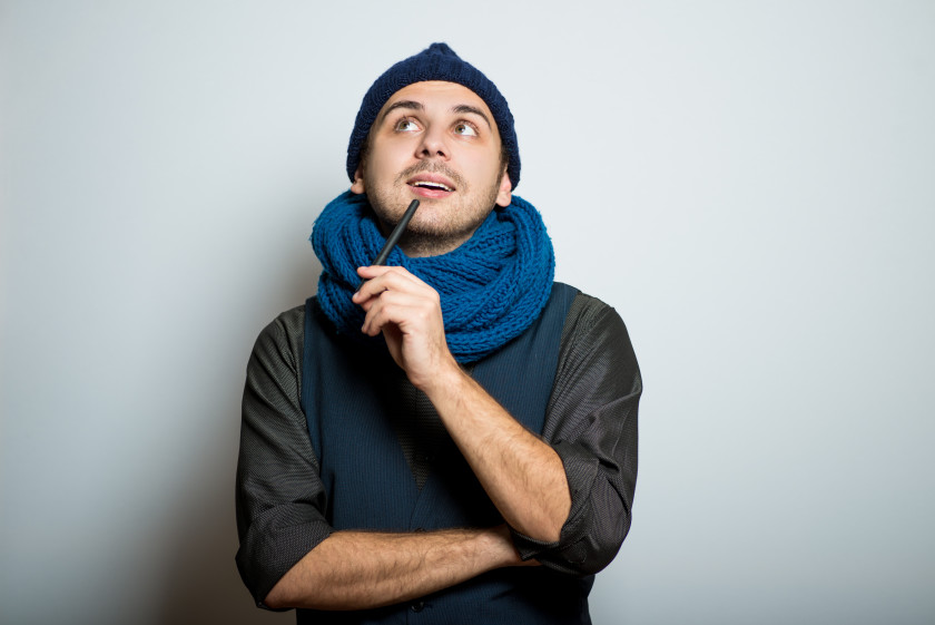 english phrases rings a bell young guy in hat and scarf remembers something