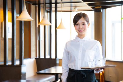 A student working part-time in a restaurant