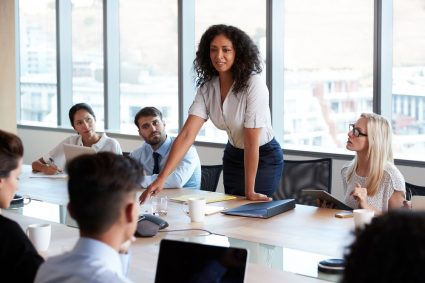 A young woman in a leadership position