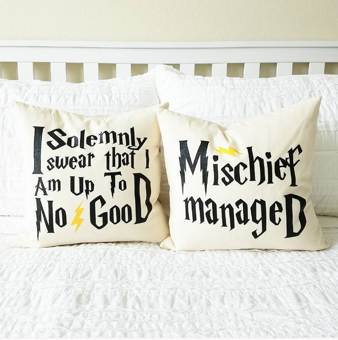 Harry Potter themed cushions on a bed