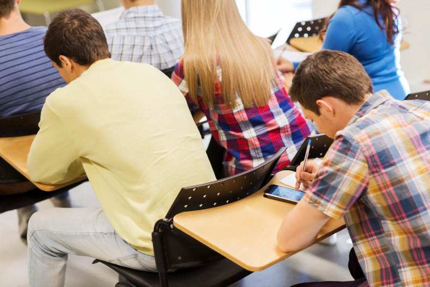 Lots of students studying in a small space