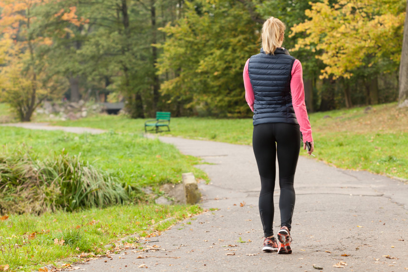 A young female student going for a walk outside