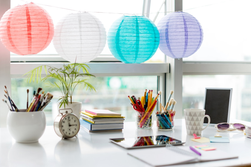 Colourful paper lanterns above a desk