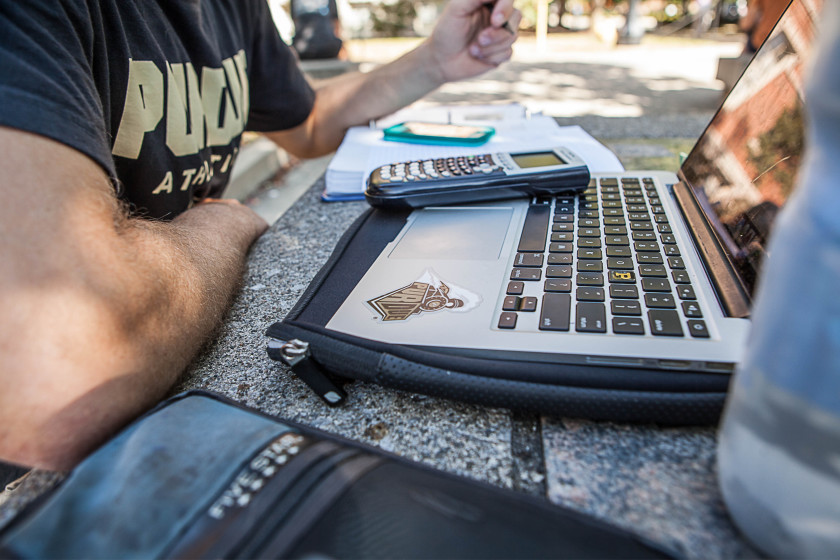 An accounting student working on his laptop