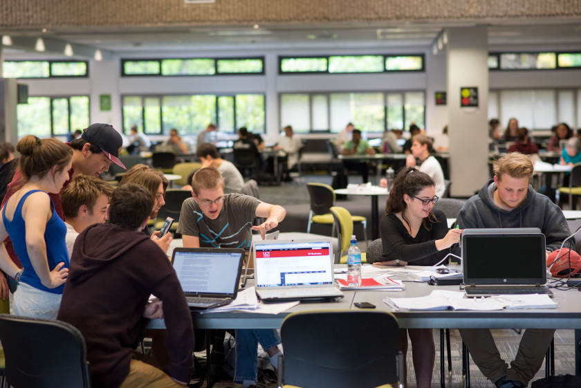 Mathematics students working in a large classroom