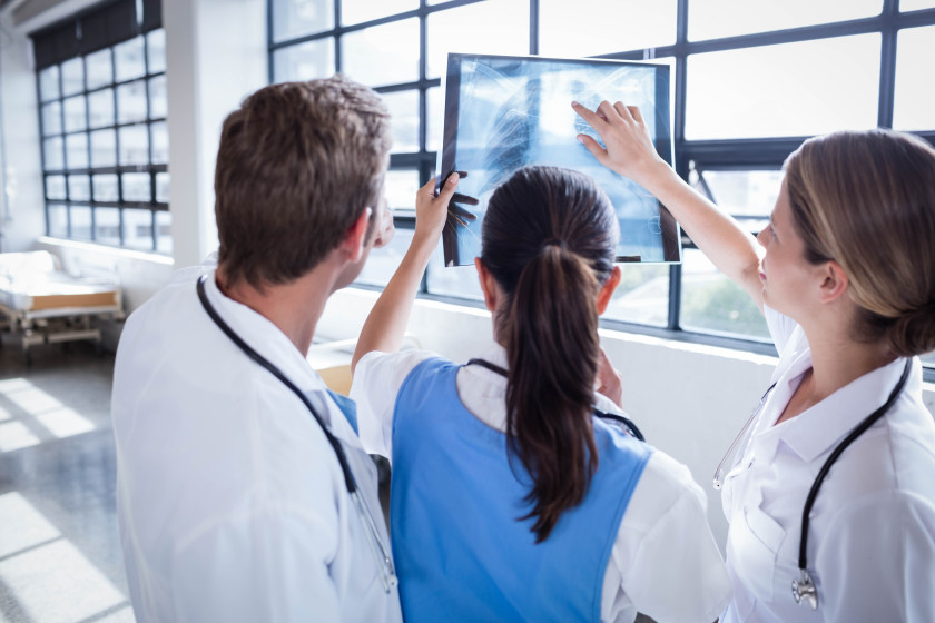 Trainee doctors looking at an X-ray