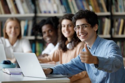 Happy students in a library