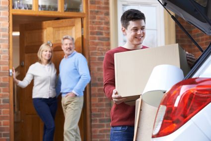 A son is packing his belongings and leaving for university