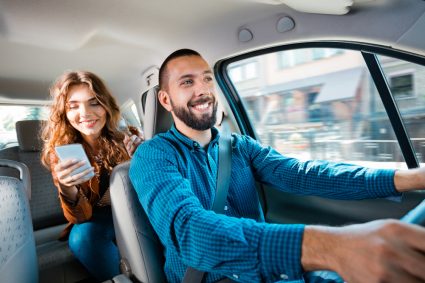 A young female student using Uber