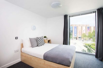 A student bedroom with a scenic window at Mary Sturge Residences
