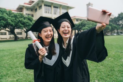Two international students at graduation