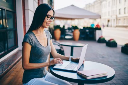A woman making a study plan on her laptop