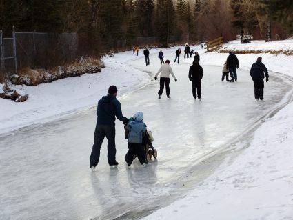 People skating on a frozen stream in Calgary