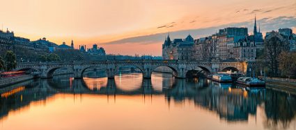 A view of the Seine River in Paris at sunset