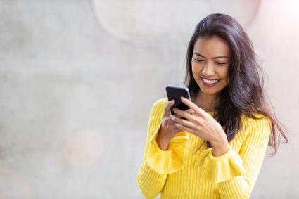 A young woman using her mobile phone