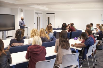 A group of students attending university orientation