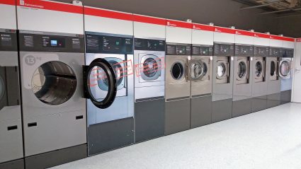 A laundromat with several washing machines