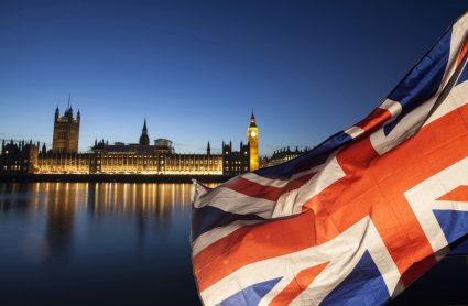 A Union Jack with the Palace of Westminster in the background