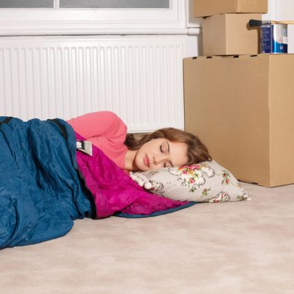 A student sleeping on the floor