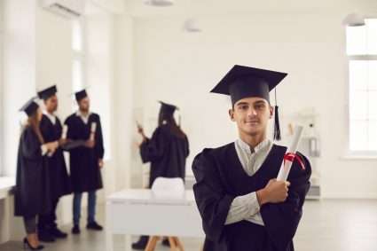 A young man in university graduation ropes