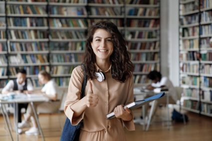 A young woman in a university library