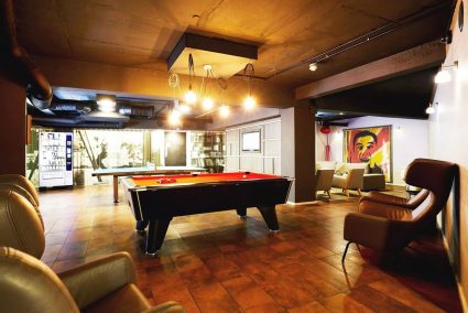 A pool table and a table tennis table at Zed Alley student accommodation in Bristol